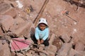 Child on Taquile Island is playing on a Construction Area. Peru