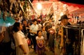 Unidentified children and families walking around thai night market with wind catchers shop