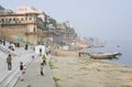 Unidentified children fly kites in the sky on riverbank of sacred river Ganges Royalty Free Stock Photo