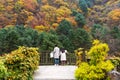 Unidentified couple with autumn view