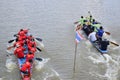 Unidentified crew in traditional Thai long boats compete during Country cup