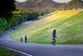 Unidentified cyclist cycling uphill