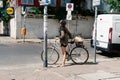 Unidentified cyclist woman in street in Scheunenviertel quarter in Berlin Mitte