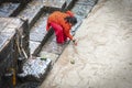 Unidentified devoted Hindu woman what is believed a holy bath in Bagmati river to wash away sins - at Pashupatinath Temple