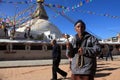 An unidentified devotee offer prays at the Buddhist pilgrimage center Boudhanath Stupa