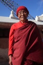 An unidentified devotee offer prays at the Buddhist pilgrimage center Boudhanath Stupa