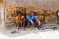 Unidentified Diola boys sit near the shack in Kaschouane villag