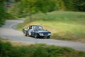 Unidentified drivers on a black vintage Lancia Fulvia racing car