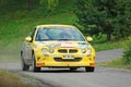 Unidentified drivers on a yellow vintage MG ZR racing car