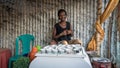 Unidentified Ethiopian woman making traditional coffee in a hut