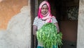 Unidentified Ethiopian woman standing at the door of her house