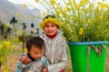 Unidentified ethnic minority kids with baskets of rapeseed flower in Hagiang, Vietnam Royalty Free Stock Photo