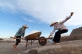 An unidentified farmers are harvesting salt