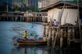 Unidentified fisherman prepare the fishing net at small boat