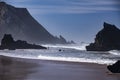 Surf fishing on Atlantic ocean coastline Adraga Beach