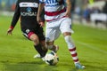 Unidentified football players compete during the OTELUL GALATI (WHITE) vs Gaz Meta (BLACK),