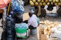 Unidentified Ghanaian man sells goods at the Kumasi market. Royalty Free Stock Photo