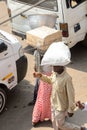 Unidentified Ghanaian people carry goods on their heads in boxe Royalty Free Stock Photo