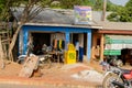 Unidentified Ghanaian people sit in the shop in local village.