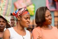 Unidentified Ghanaian women attentively look at something.