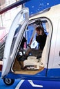 Unidentified girl in a helicopter cockpit