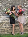 Unidentified Estonian girls with flower bouquets