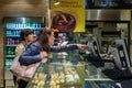 Unidentified girls ordering baked products