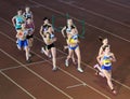 Unidentified girls run 2,000 m. steeplechase race Royalty Free Stock Photo