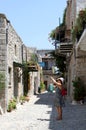 Unidentified Greek Tourist taking photos at Historic Mesta Village in Chios, Greece