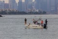 Unidentified of a group people are fishing in the middle sea Royalty Free Stock Photo