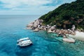 Unidentified group of tourists or traveller are swimming and snorkeling relaxation in Andaman sea, Thailand Royalty Free Stock Photo