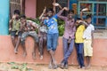 Unidentified happy rural poor children teenagers playing at street of village