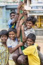 Unidentified happy rural poor children teenagers playing at street of village