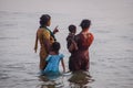 Unidentified Hindu family do holy bathe at the sacred confluence on Papanasam beach