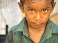 Unidentified indian dalit shy cute boy in the street. Children of Tamil Nadu suffer of poverty Royalty Free Stock Photo