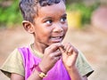 Unidentified indian dalit shy cute boy in the street. Children of Tamil Nadu suffer of poverty Royalty Free Stock Photo