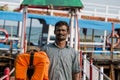 Documentary editorial. RAMESWARAM, RAMESHWARAM, TAMIL NADU, INDIA - March circa, 2018. Unidentified indian man hang Life jacketfor Royalty Free Stock Photo