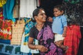 Unidentified Indian woman and baby in her arms are smiling with very Royalty Free Stock Photo