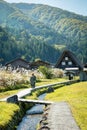 Unidentified Japanese with a background of Shirakawago village during autumn with a triangle house Royalty Free Stock Photo