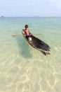 Unidentified kid on the canoes at Mabul island