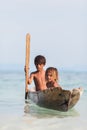 Unidentified kids on the canoes at Mabul island