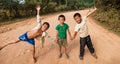 Unidentified kids posing on a road in Vang Vieng