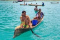 Unidentified local BAJAU LAUT people on wooden boat