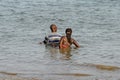 Unidentified local couple swim on the coast of the Atlantic oce