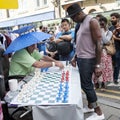 Unidentified local people played chess at Brick lane street in London UK.