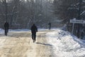 Unidentified locals men ride bicycles on the winter road