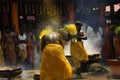 Male devotees perform holy bath ritual with hot turmeric water