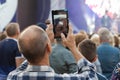 Unidentified man filming scene by pad during a concert dedicated Moscow city day on September 9, 2019