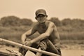 Unidentified man fishing in the Tonle sap River Royalty Free Stock Photo