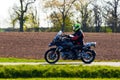 Unidentified man with helmet riding a bike